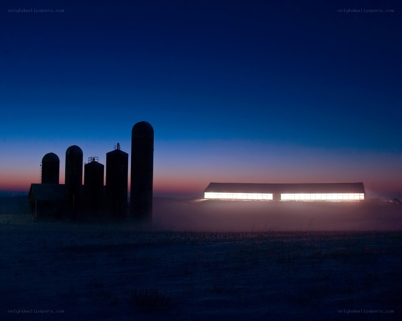 Farm silos at dawn