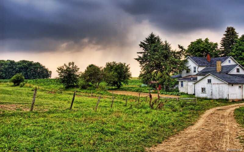 Farm under stormy sky