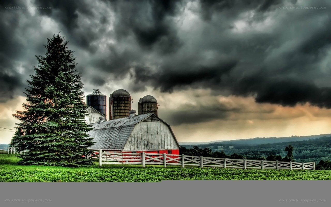 Farm under stormy sky