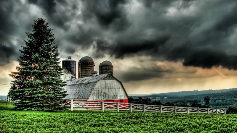 Farm under stormy sky