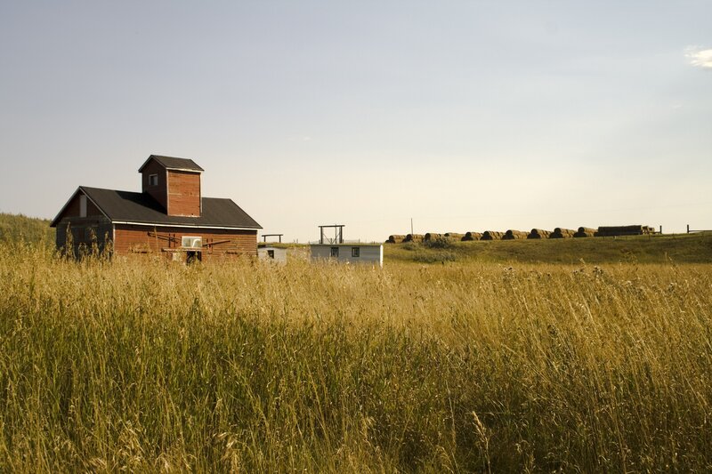Farm with hay bales and barn