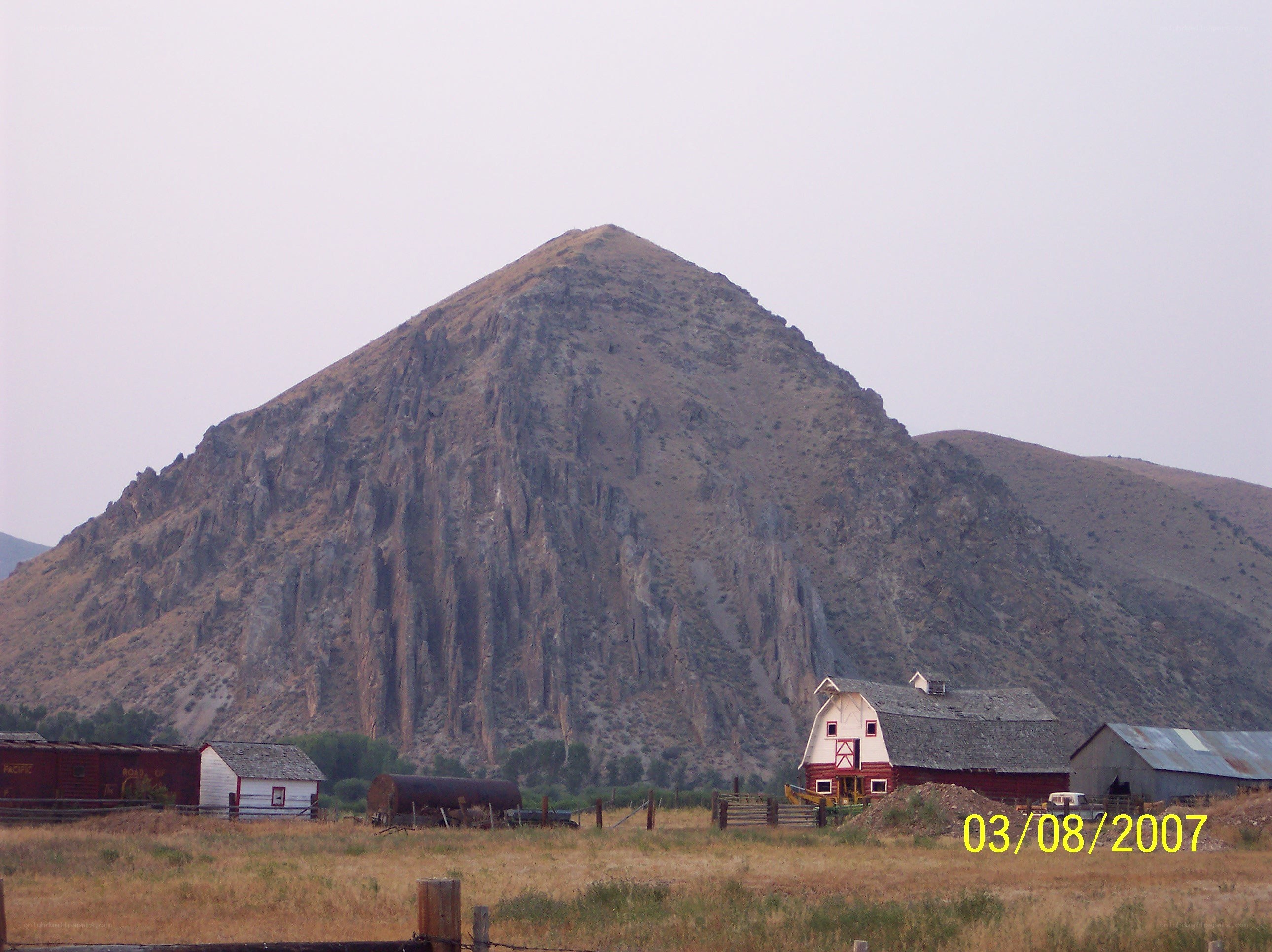 Farm with mountain backdrop