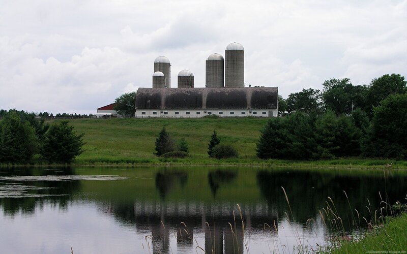 Farm with silos and pond