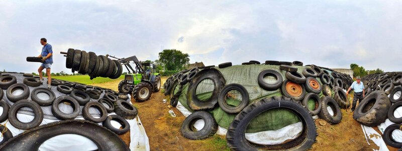 Farmers working with tires