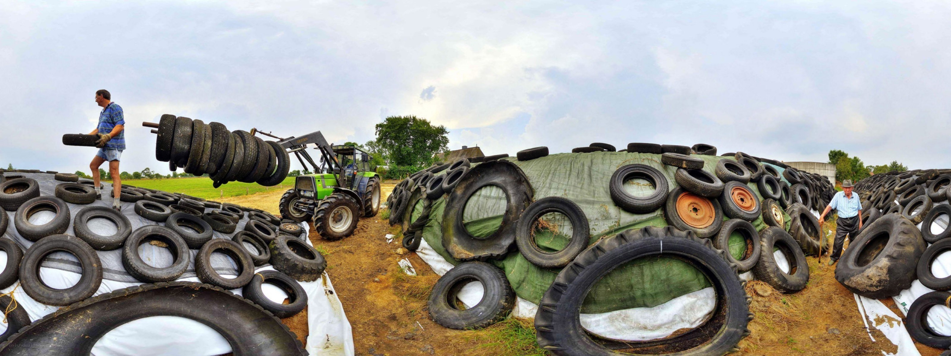 Farmers working with tires