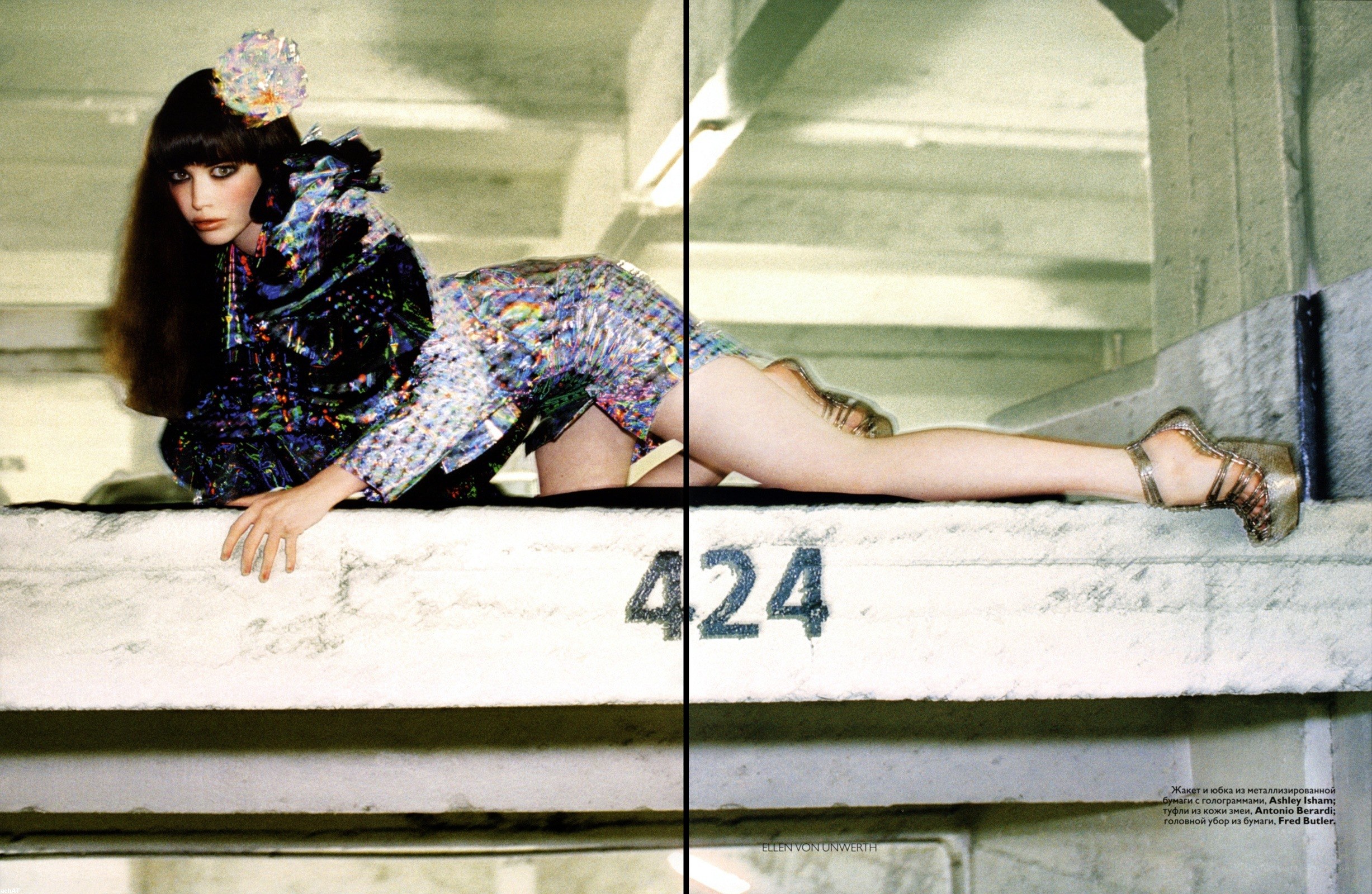 Fashion model on concrete ledge