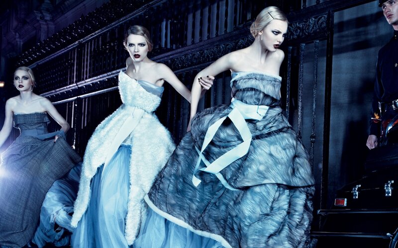 Fashion models in elegant gowns