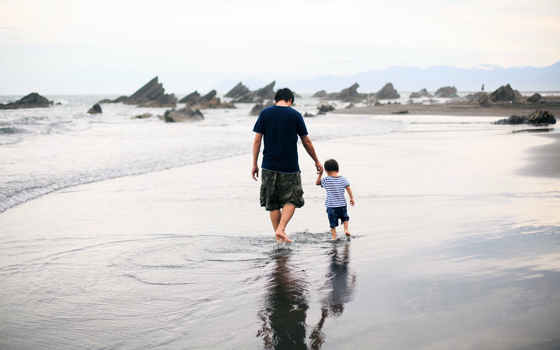 Father and son on the beach