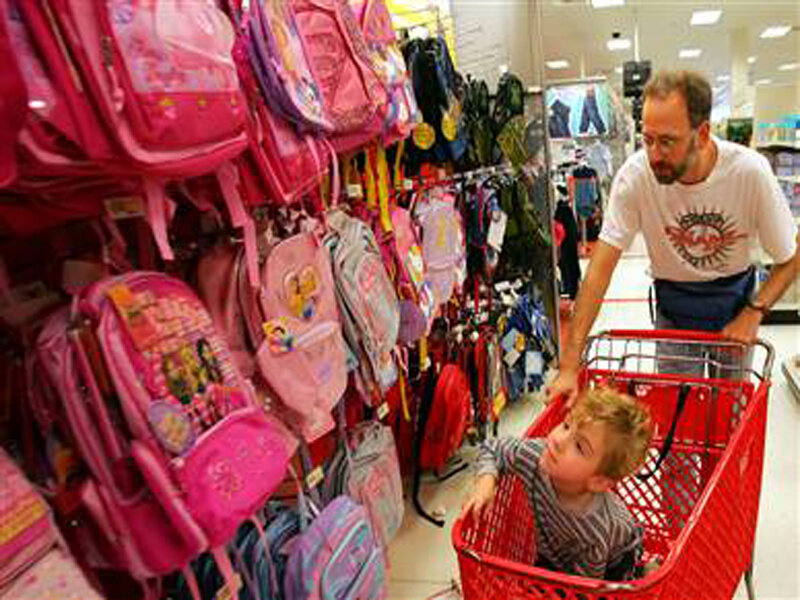 Father and son shopping for backpacks