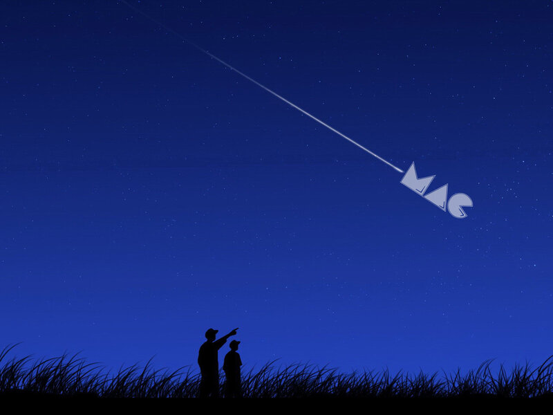 Father and son watching a shooting star