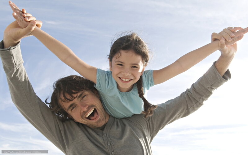 Father giving daughter a piggyback ride