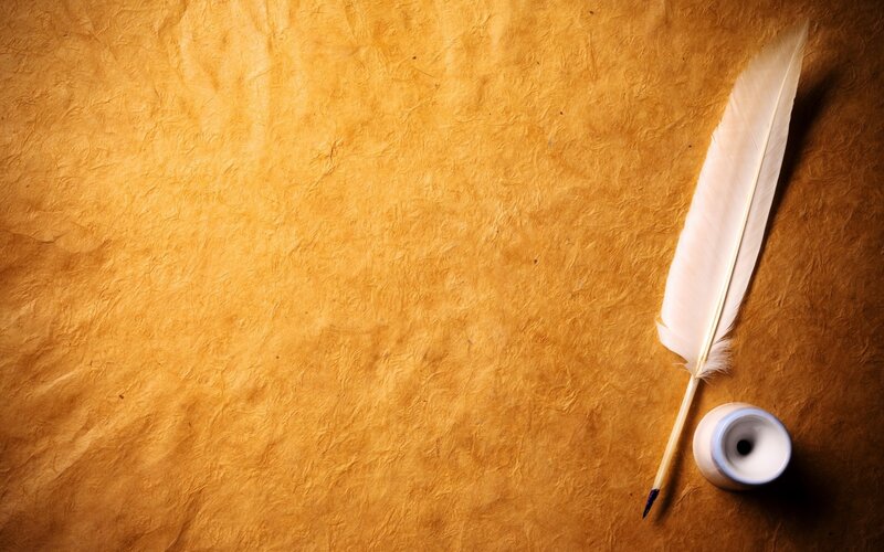 feather quill on parchment