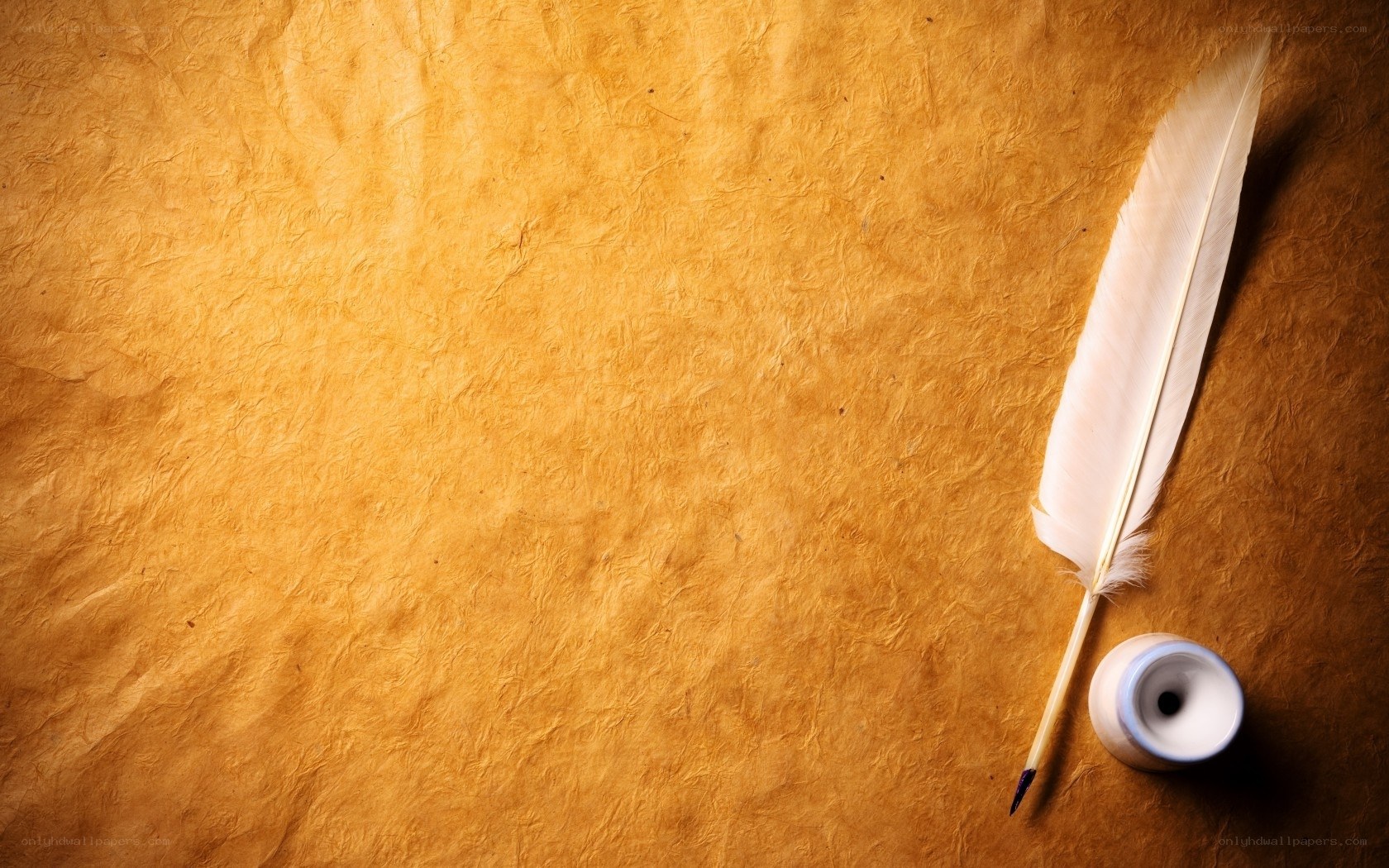 feather quill on parchment