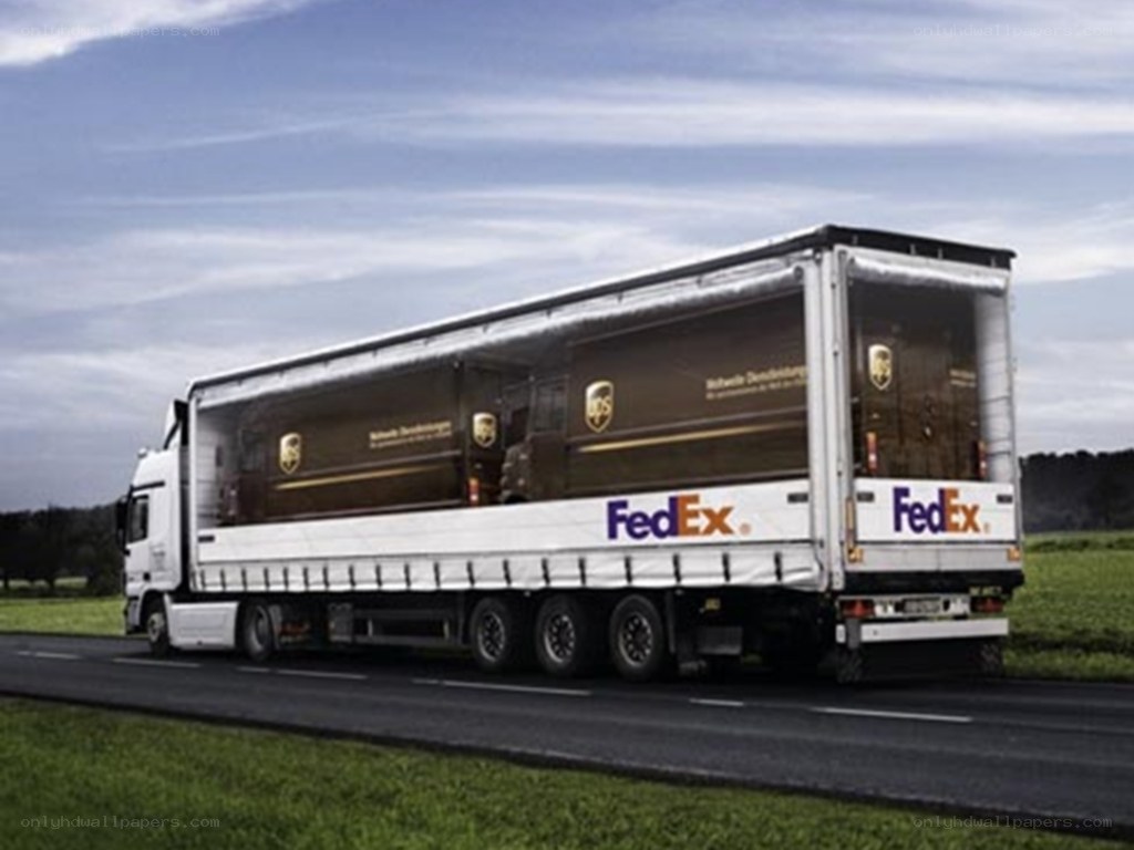 FedEx and UPS truck on road