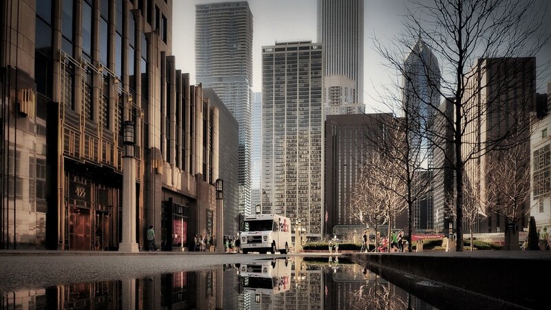 FedEx truck in Chicago cityscape
