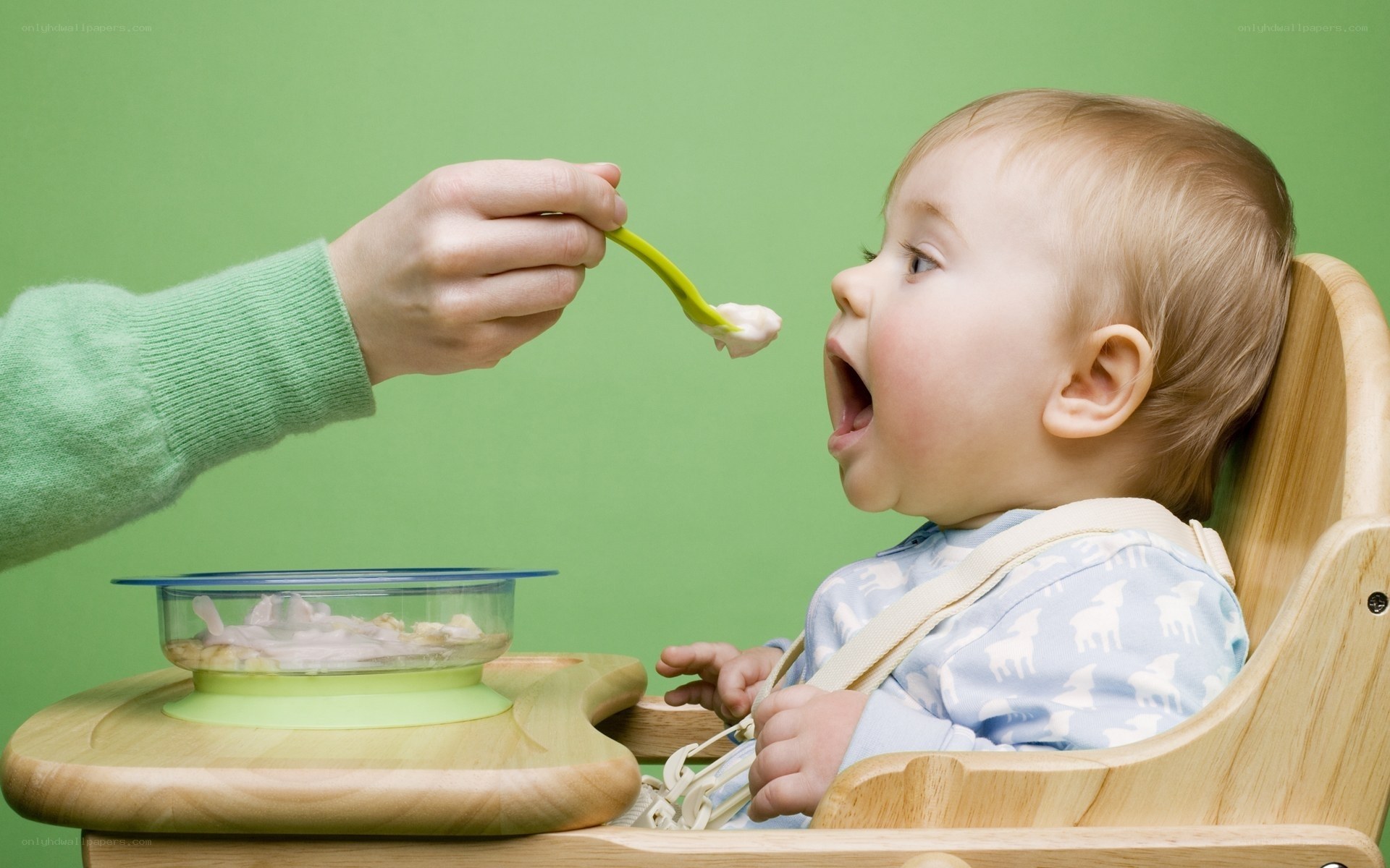 feeding baby with spoon