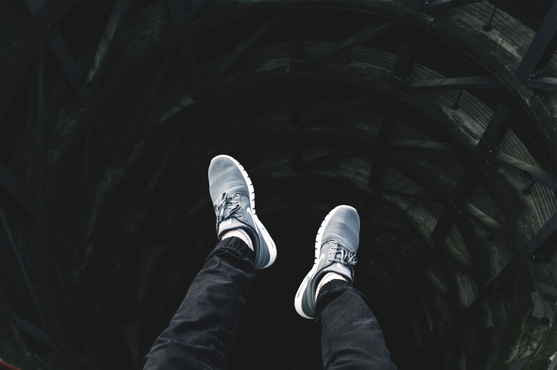 feet in a dark tunnel