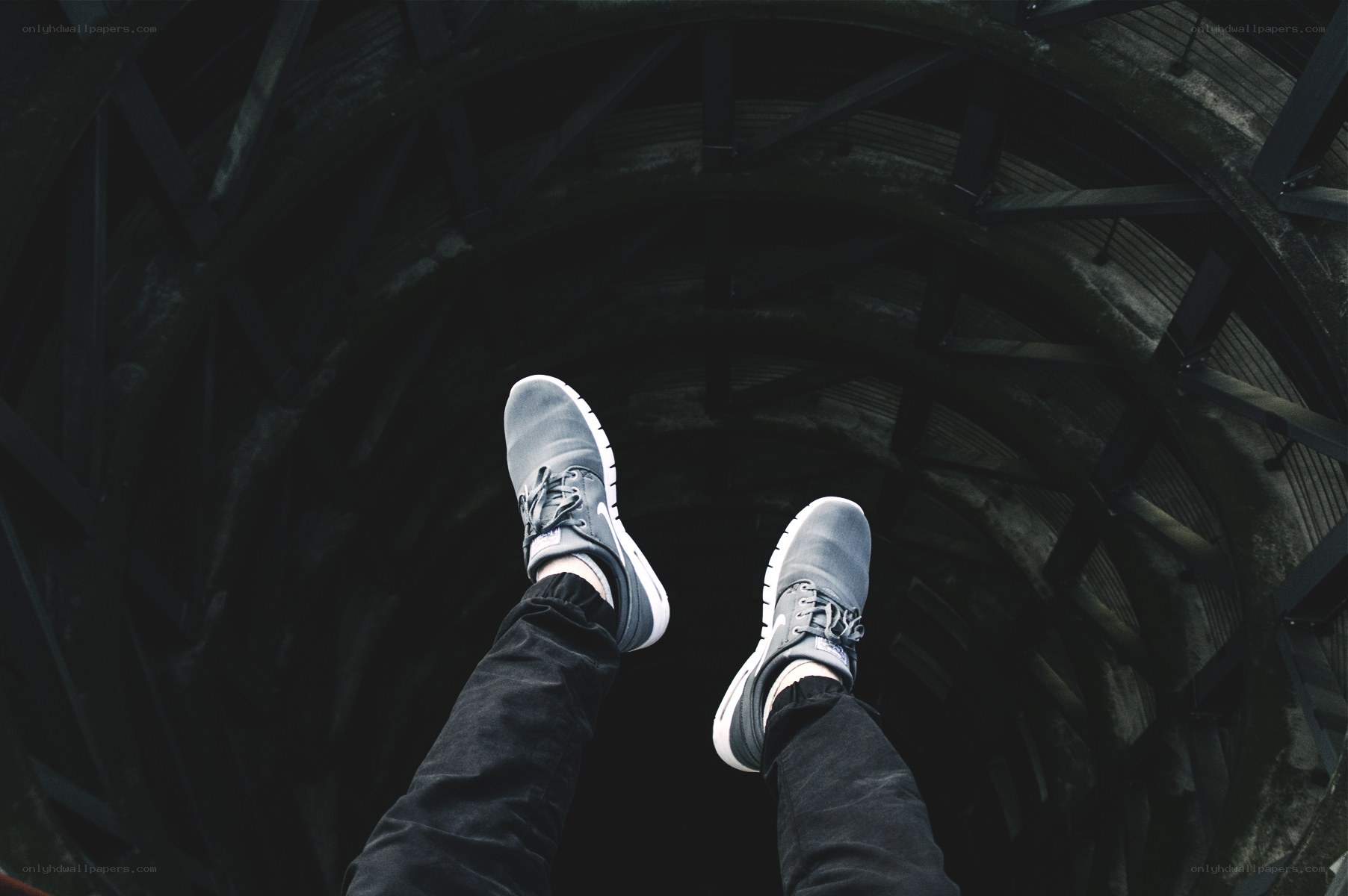 feet in a dark tunnel