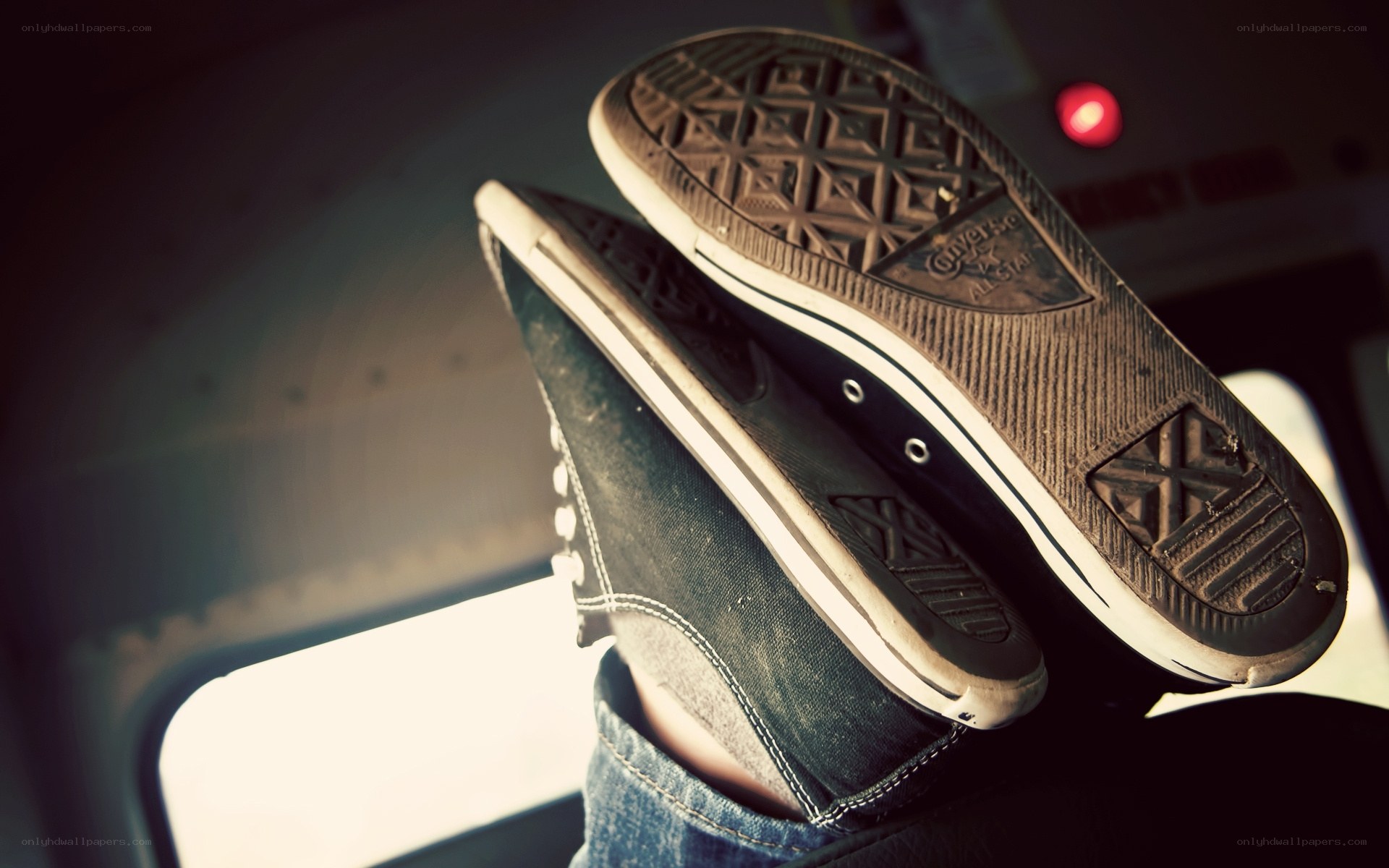 feet in converse sneakers