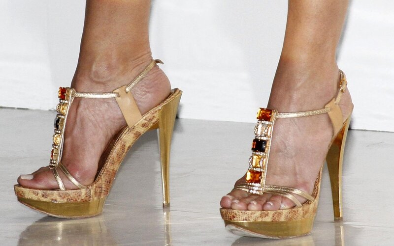 Feet in High-heeled Sandals — Gold