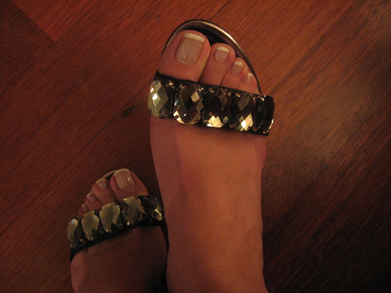 feet in jeweled sandals