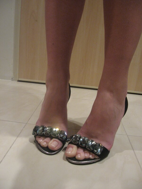 feet in jeweled sandals