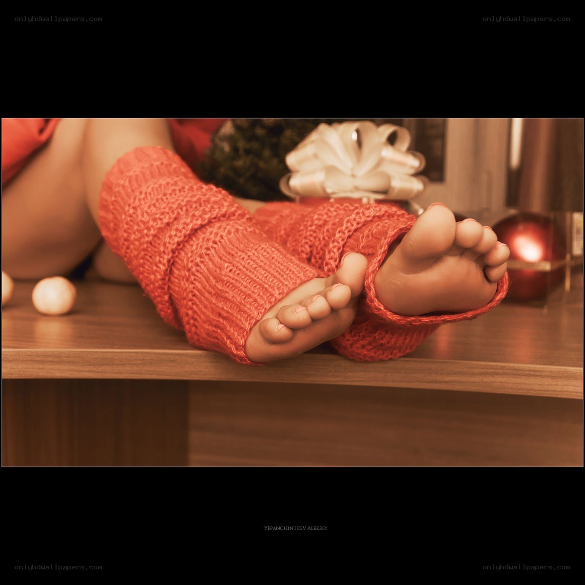 feet in red socks on table