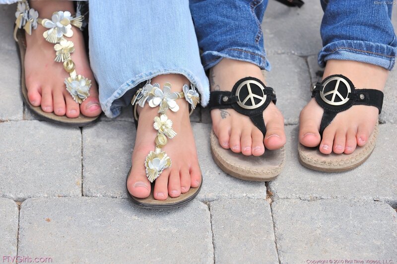 feet in sandals on pavement