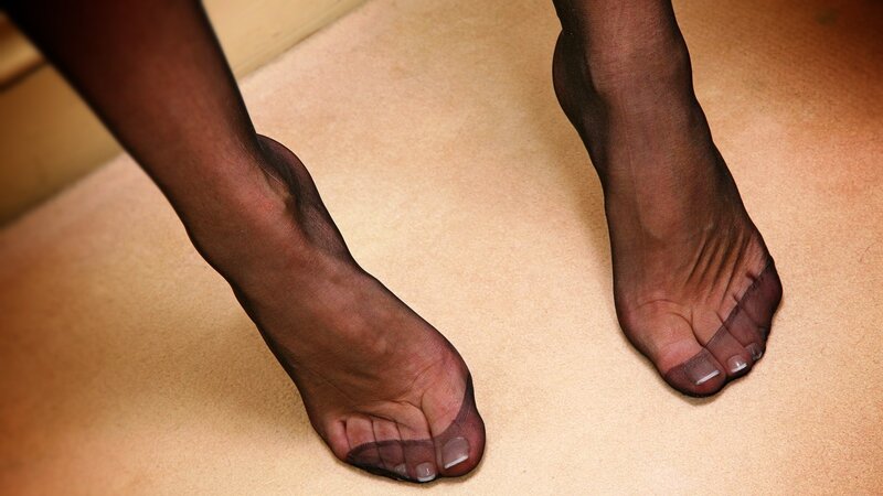 feet in sheer black stockings