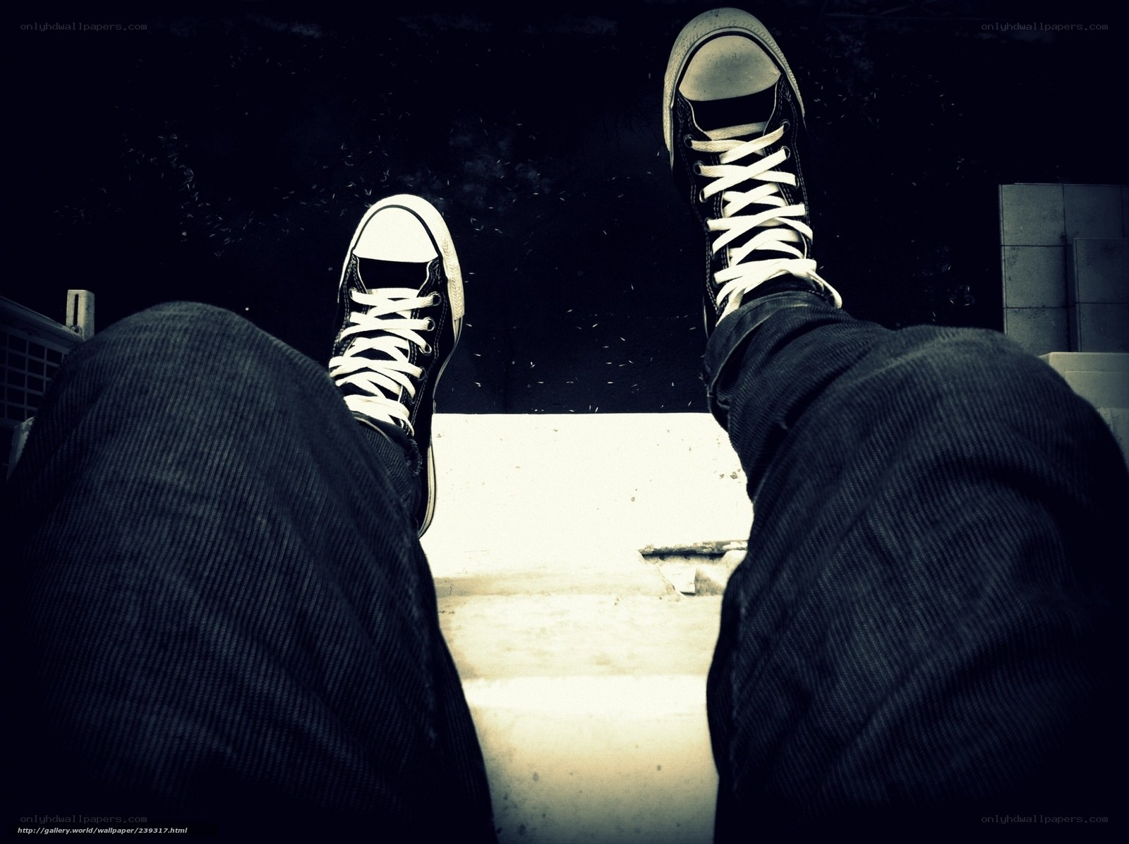 feet in sneakers from above