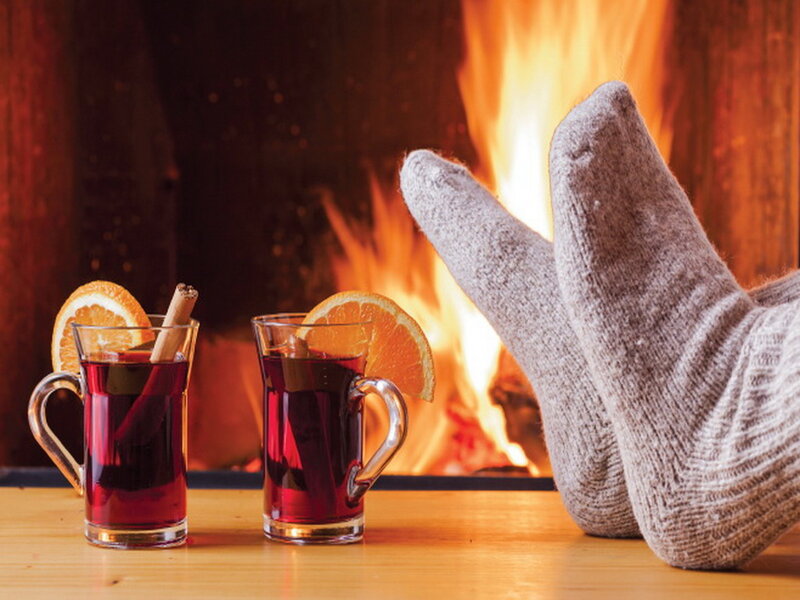 Feet in Socks by Fire