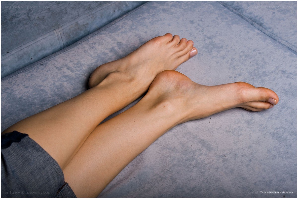 feet on a blue couch