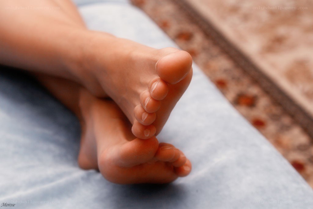 feet on a blue surface