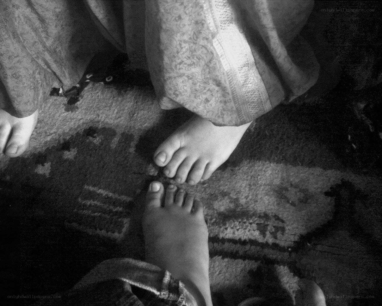 feet on a patterned rug
