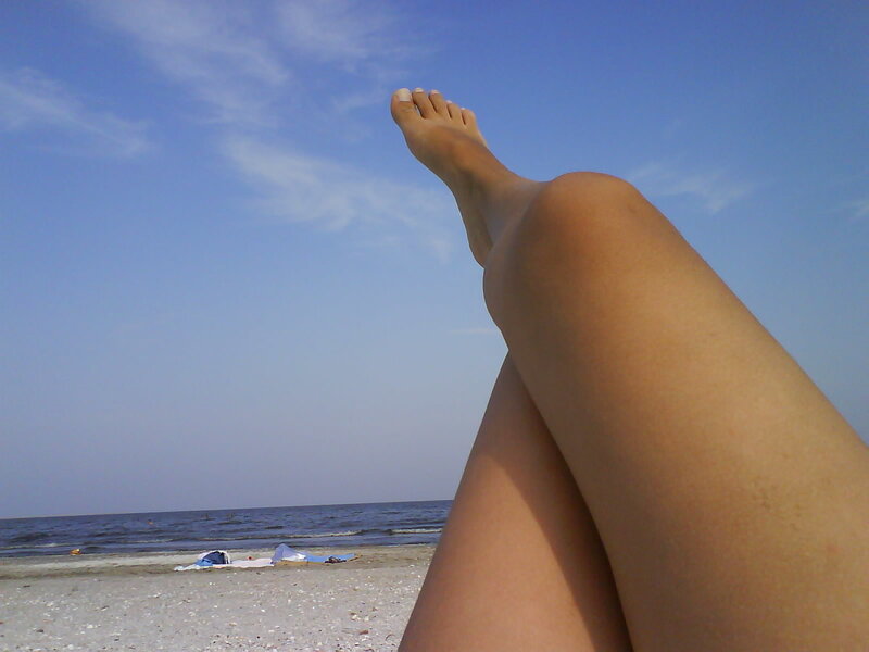 feet on a sunny beach