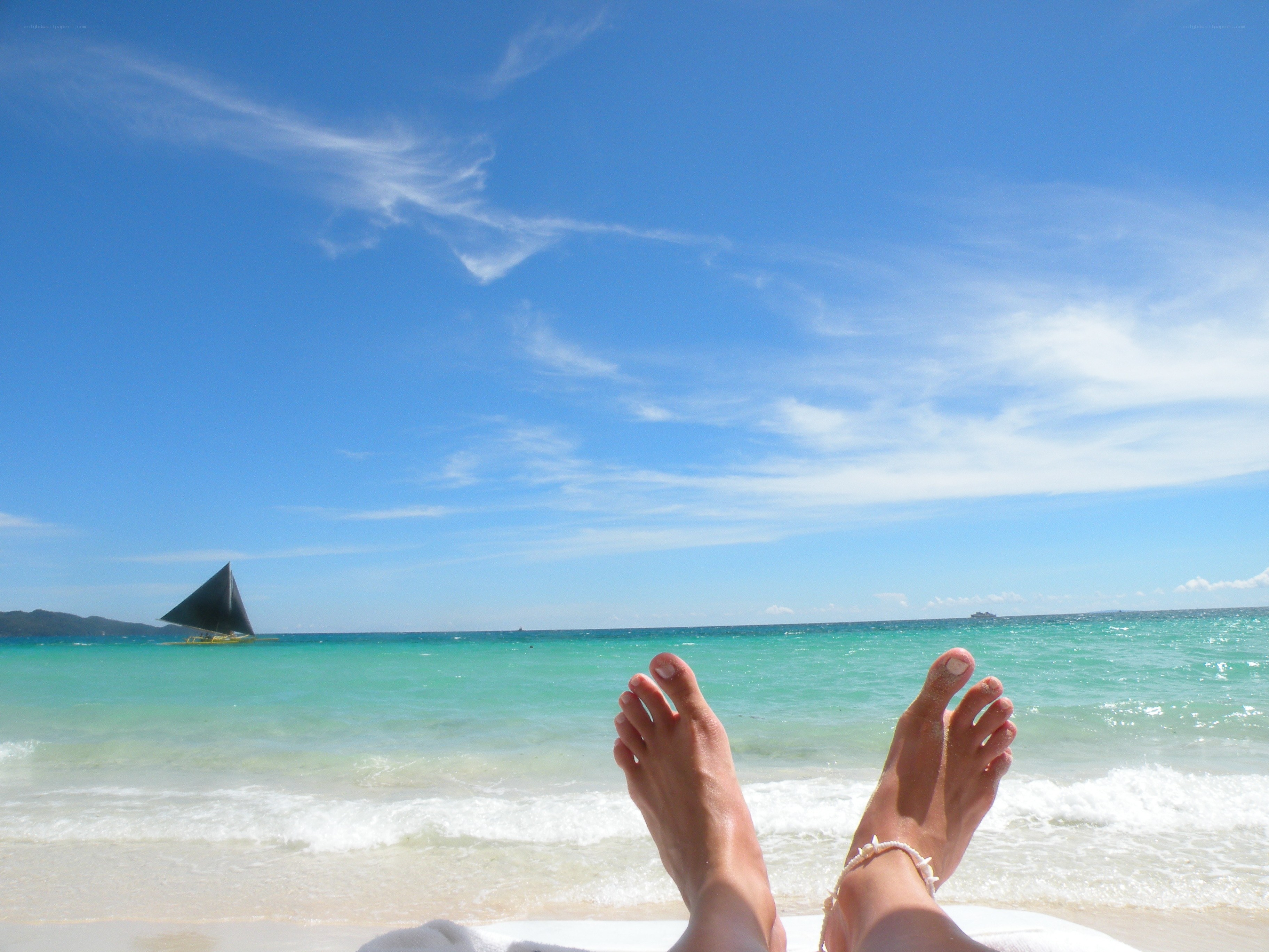 Feet on a tropical beach
