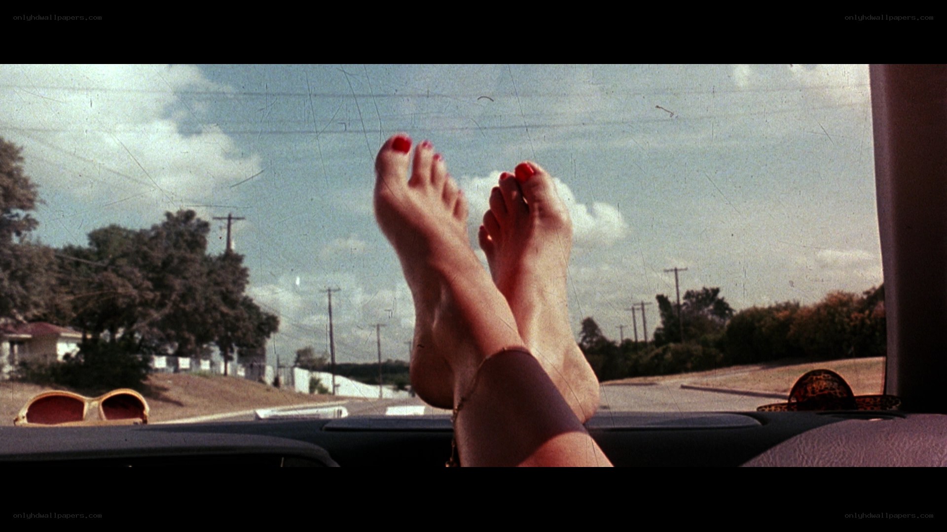 feet on car dashboard