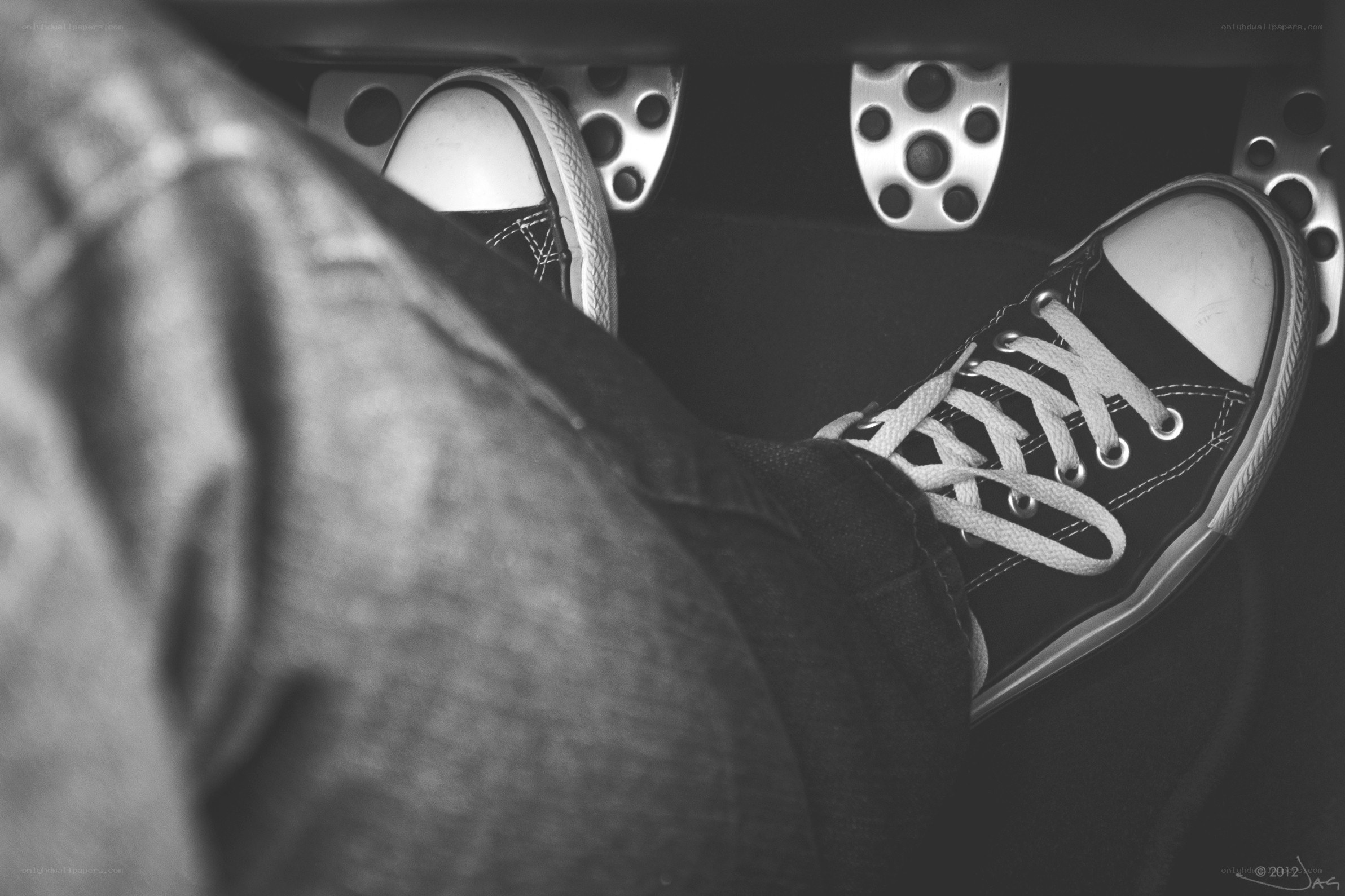 feet on car pedals
