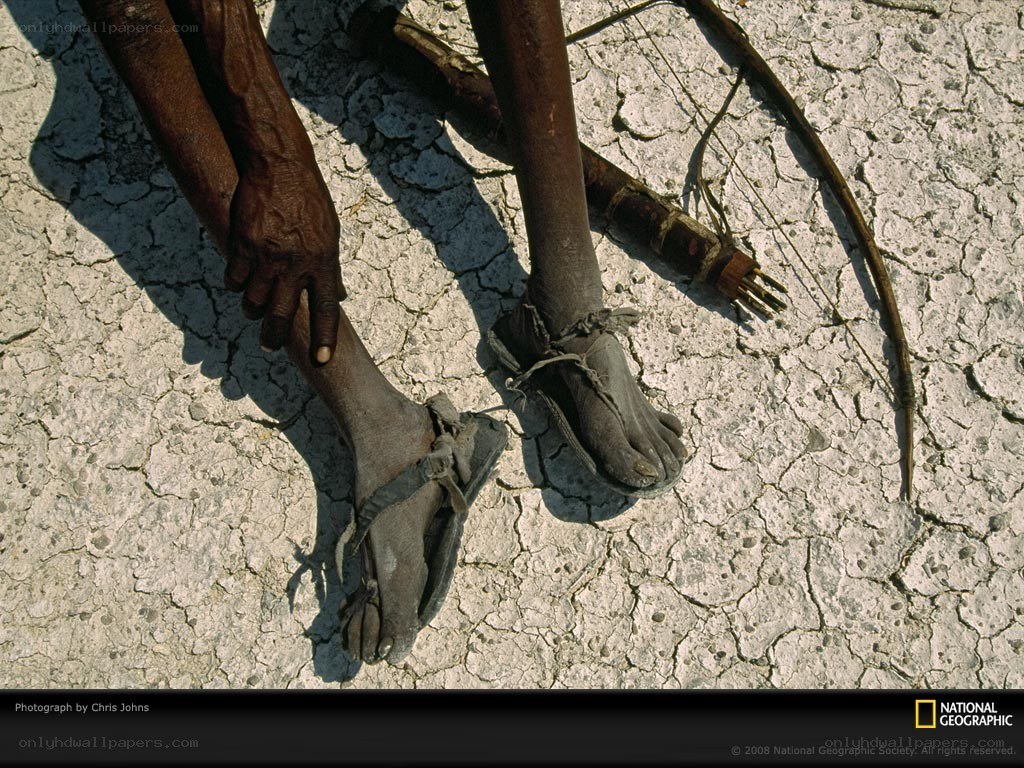 Feet on cracked earth