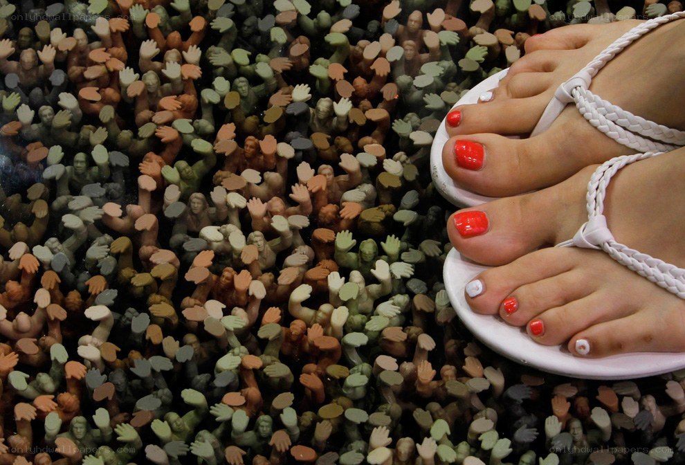 feet on crowd sculpture