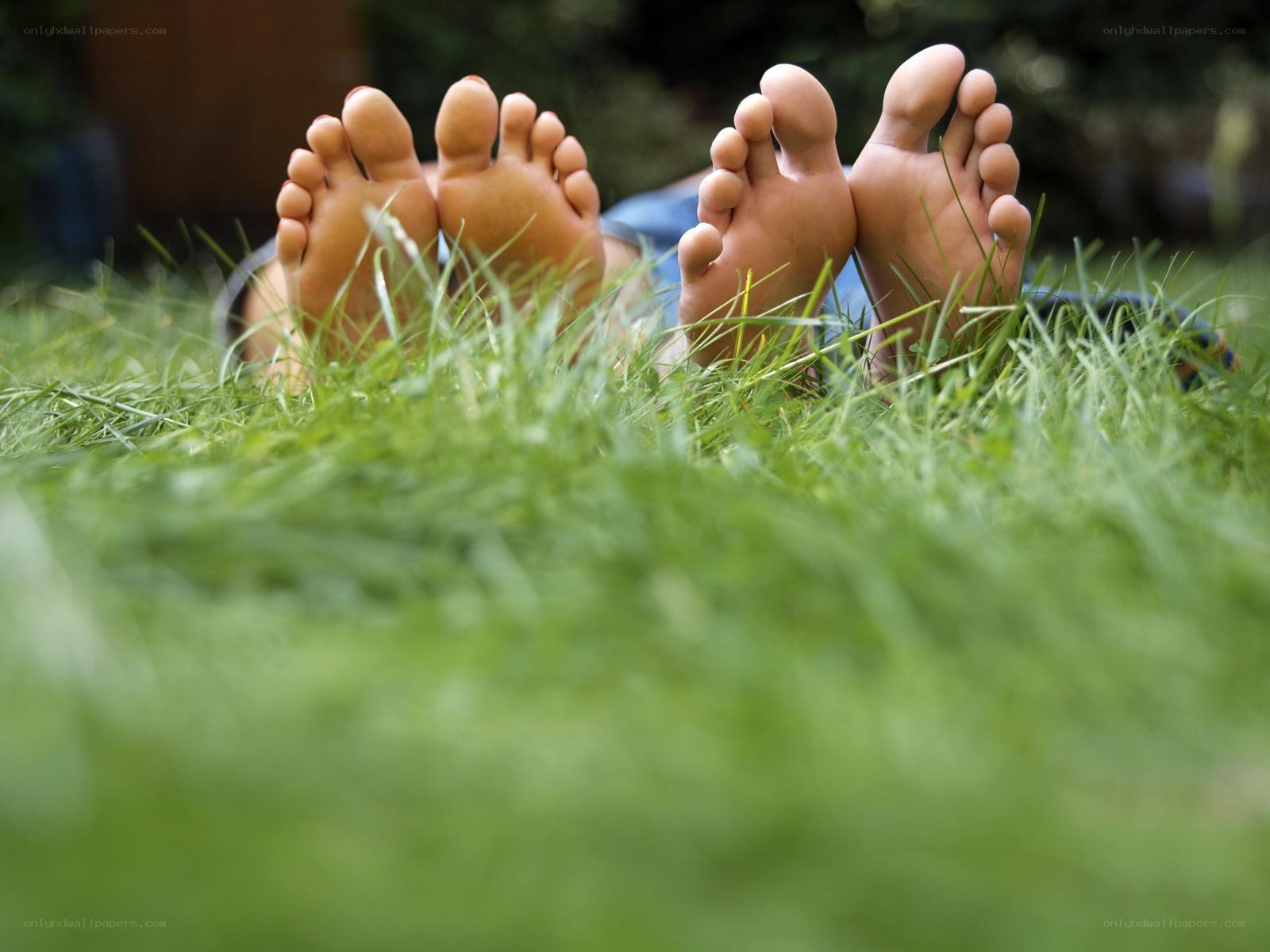 feet on green grass