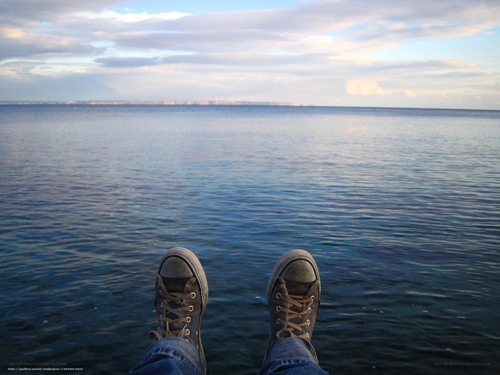 feet on the water's edge