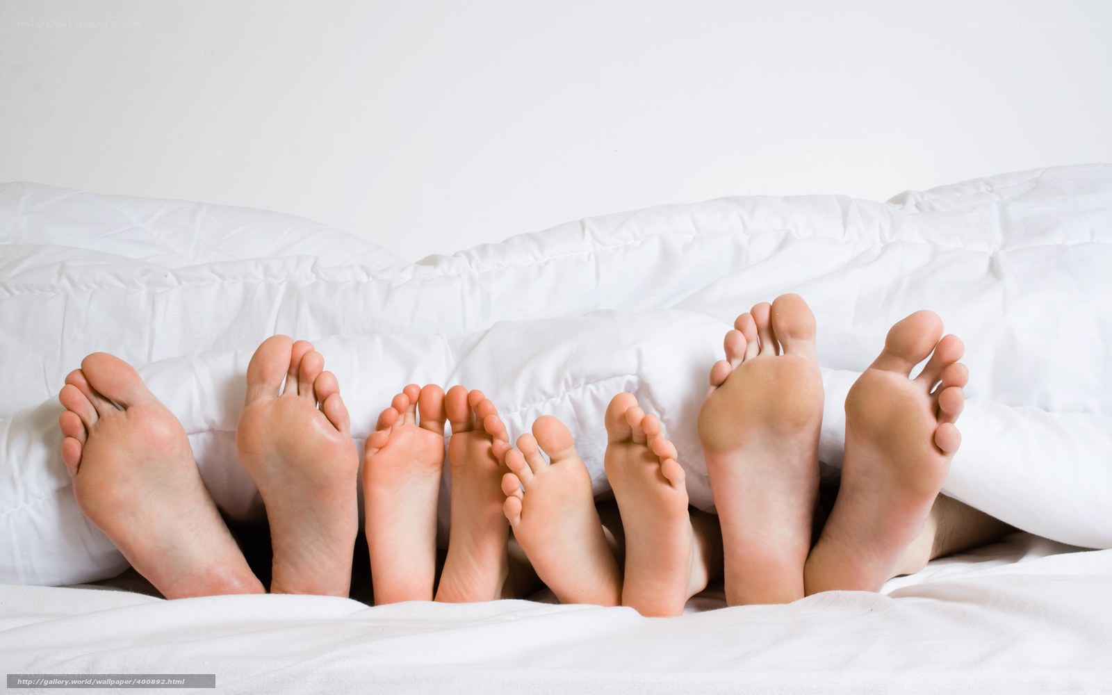 feet under white blanket