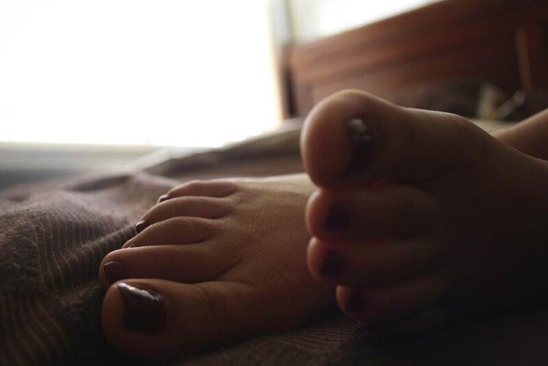 Feet with Dark Nail Polish — Brown