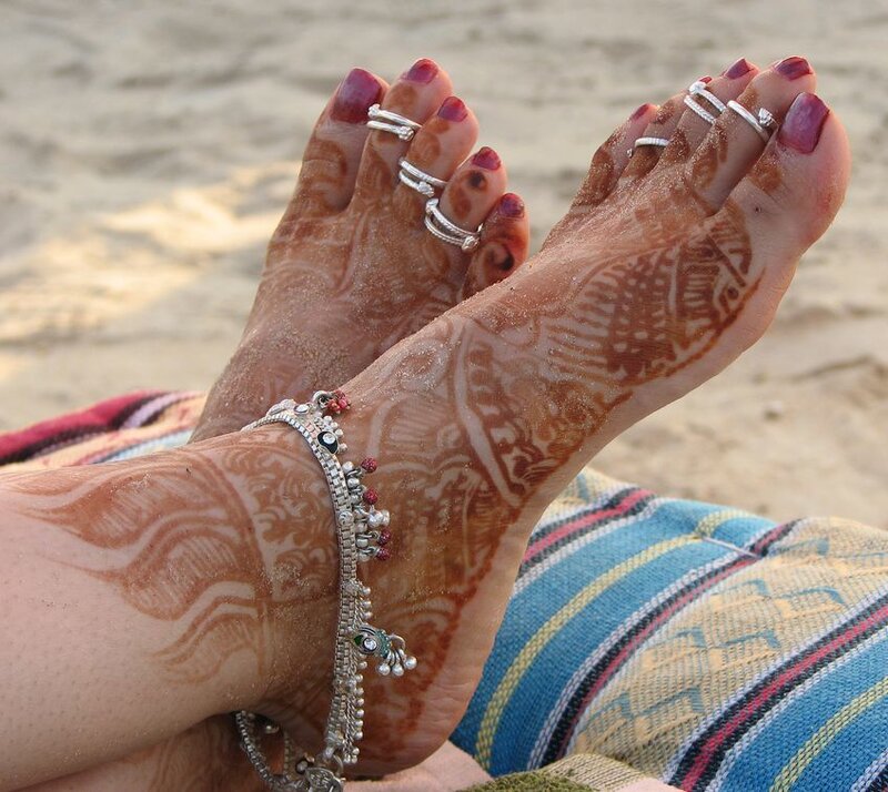 feet with henna and jewelry