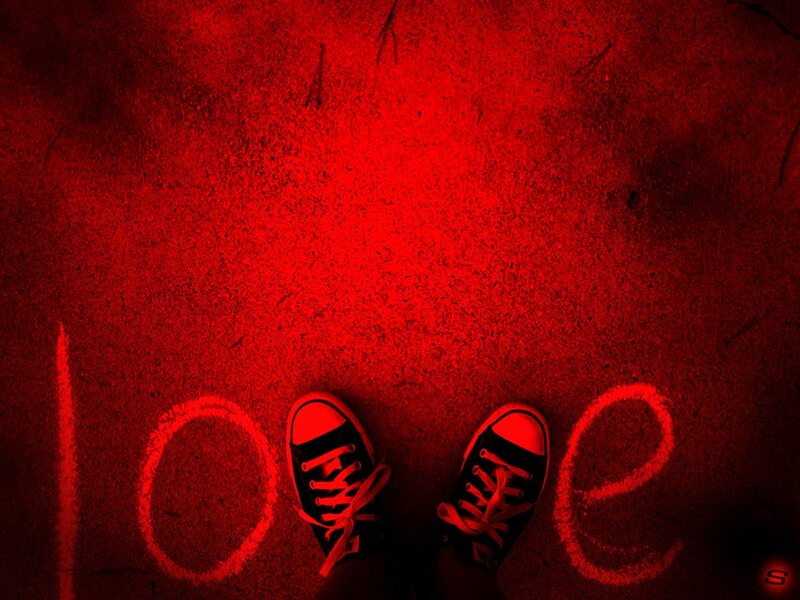 Feet with 'love' written on ground