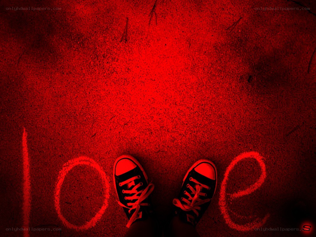 Feet with 'love' written on ground