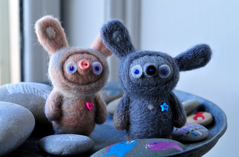 Felt animal figures on stones