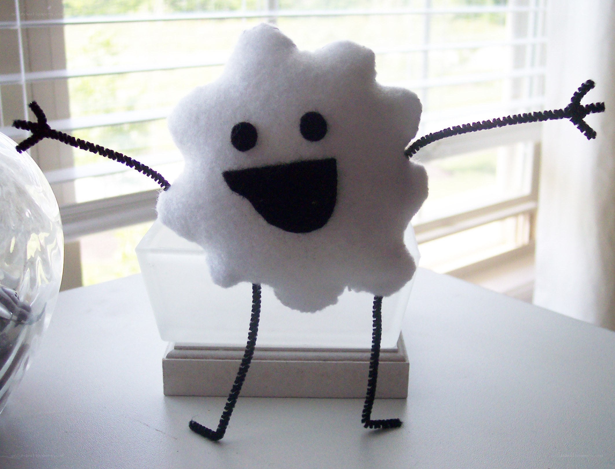 Felt cloud character with pipe cleaner limbs