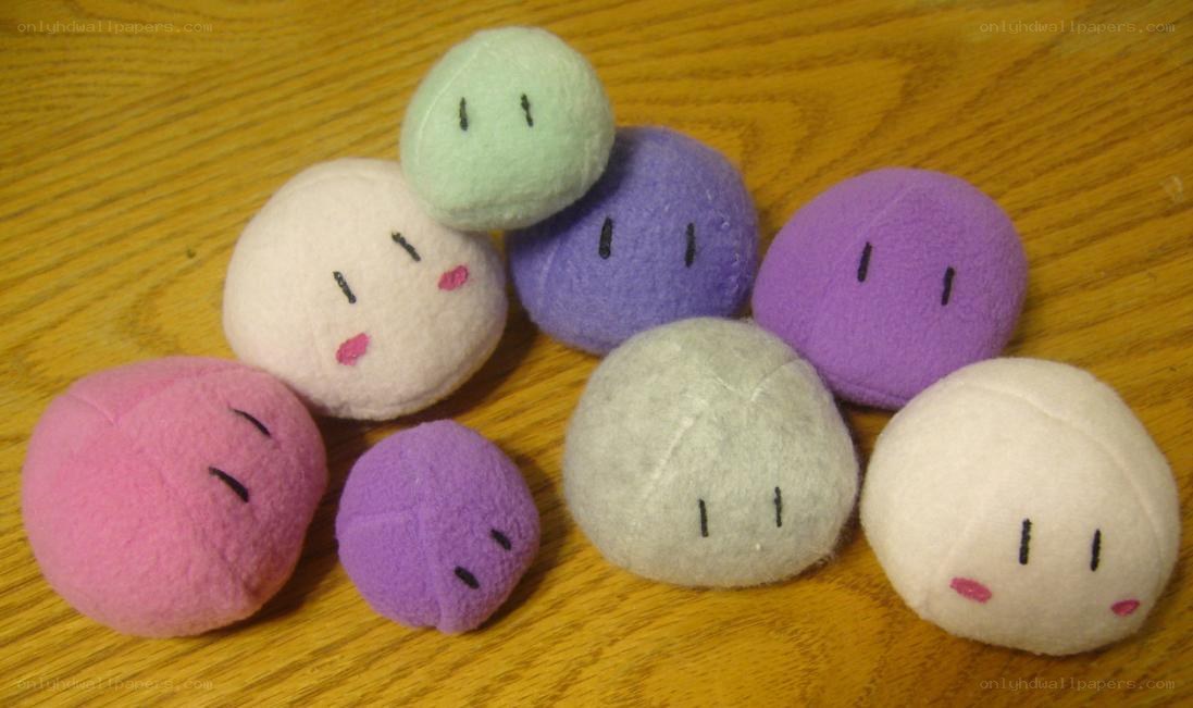 Felt plush characters on wood